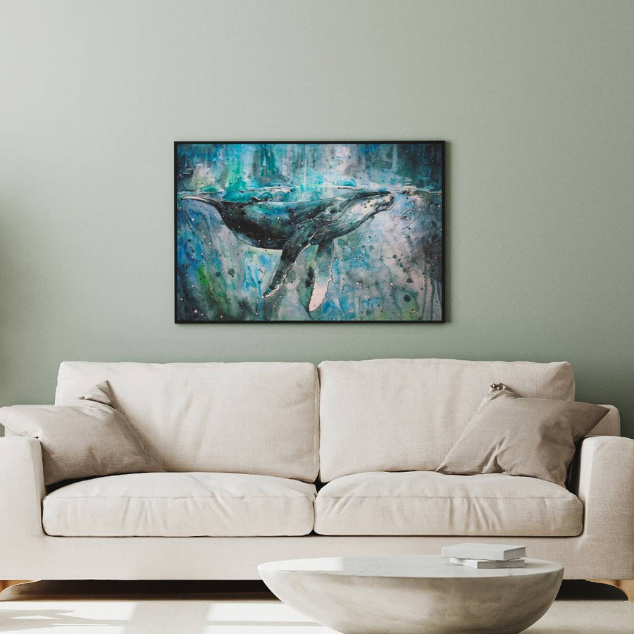 Abstract whale painting on wall above beige sofa in modern living room.