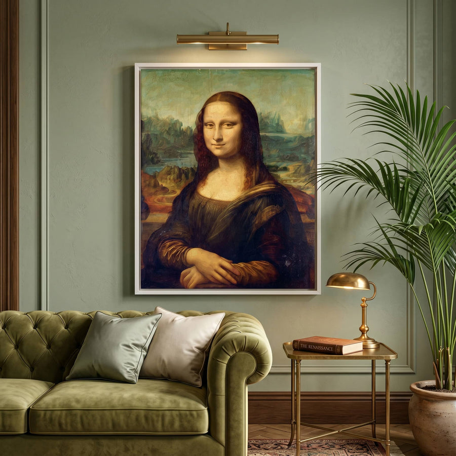 Framed Mona Lisa painting hanging on a modern green wall above a white couch with green cushions and a leafy plant.