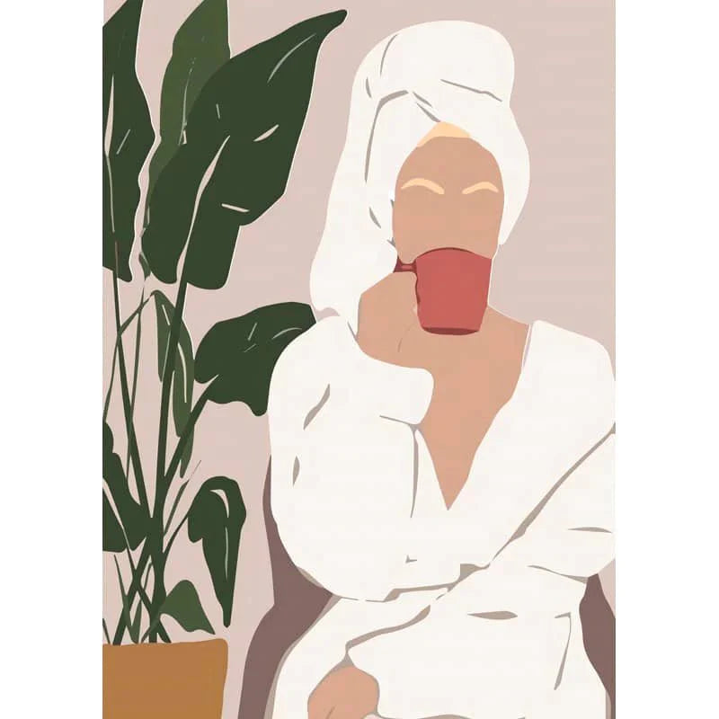 Woman in a bathrobe with towel on head drinking coffee next to large indoor plant.
