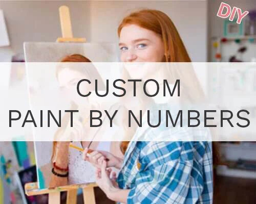 Young woman painting a custom paint by numbers canvas in an art studio.