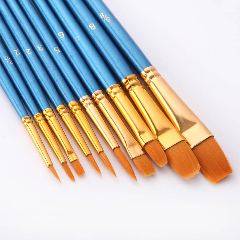 Set of blue-handled paint brushes with golden ferrules in various sizes for painting.