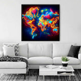 Paint by Numbers - Glowing World Map artwork in neon colors, depicting continents, hung above a modern white sofa in a stylish living room.