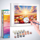 Paint by Numbers - Bright Morning kit featuring a hand painting a sunrise over tulip fields in vibrant colors with included paint supplies and box.
