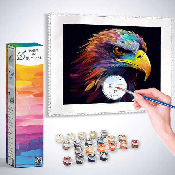 "Paint by Numbers Colourful Spirit kit featuring an eagle with vibrant feathers and paint supplies, showcasing a hand painting the numbered canvas."