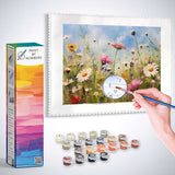 Paint by Numbers - Summer Meadow Daydreaming kit with canvas, paints, and brush showing a colorful meadow of wildflowers against a blue sky.