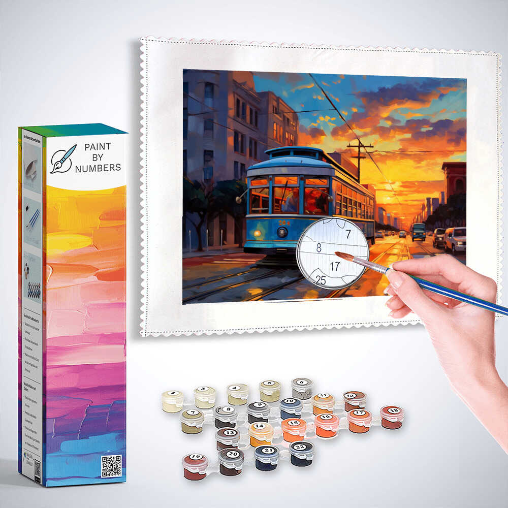 Paint by Numbers kit depicting a tram train in a vibrant evening cityscape with bright oranges and reds, modern buildings silhouetted against the sky.
