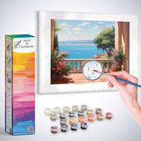 Paint by Numbers Mediterranean Whispers kit featuring an impressionistic scene of a stone terrace with flowerpots overlooking an azure sea.