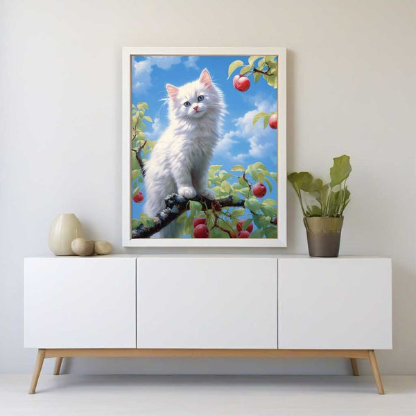 Paint by Numbers - Heavenly Curiosity painting featuring a white kitten with blue eyes on a tree branch surrounded by ripe apples and blue sky