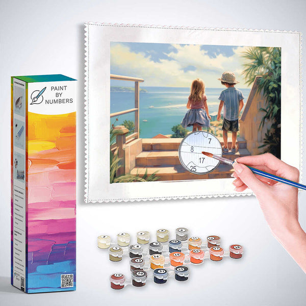 Paint by Numbers kit of two children overlooking an azure blue sea with paint and brush, depicting an impressionist Mediterranean scene.