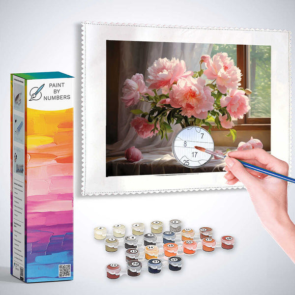 Paint by Numbers kit featuring a morning light scene with peonies in a glass vase, an artist’s hand painting detailed petals.