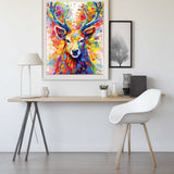 Paint by Numbers - Colorful Forest artwork of a vibrant deer on a wall in a modern, minimalist room with a desk and white chair.