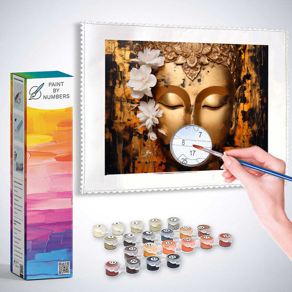 Paint by Numbers kit featuring serene Buddha face with black, gold, and orange abstract background, and a hand painting the image.