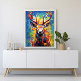 Paint by Numbers Colourful Forest - Stag with blooming antlers in vibrant blue, yellow, and red forest scene on modern white cabinet