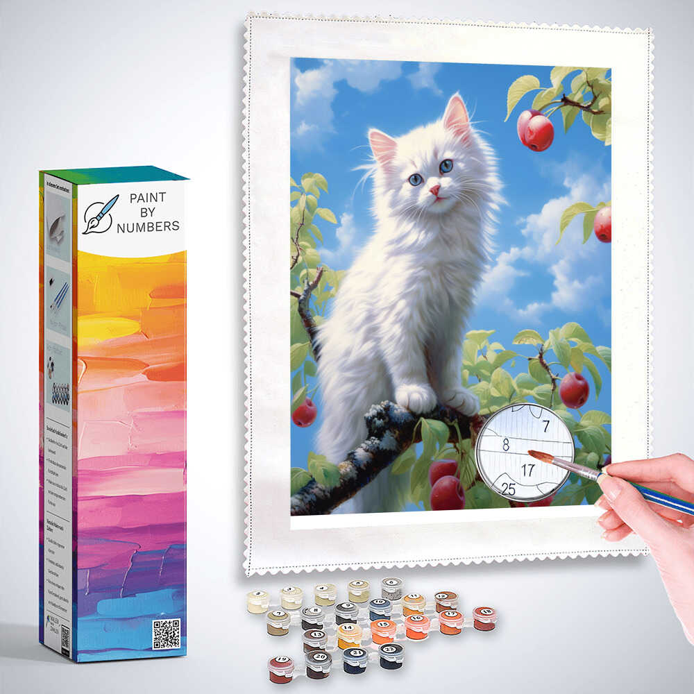 Paint by Numbers kit with a white kitten on a tree branch, surrounded by ripe apples and a bright blue sky, being painted.