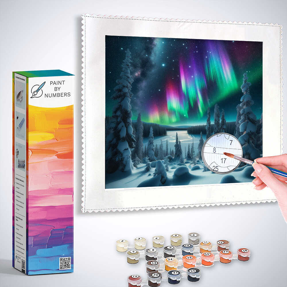 Person painting a Paint by Numbers set depicting Northern Lights over a winter forest with supplied paints.