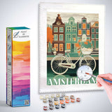 Paint by Numbers - Amsterdam's Idyll kit with a bicycle by a canal and colorful houses in Amsterdam, reflecting a serene urban oasis