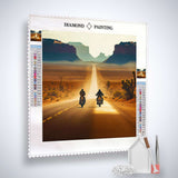 Diamond Painting kit featuring two motorbikes on a desert road at sunset with tools included for Paint by Numbers.