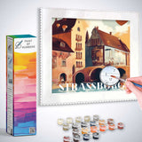 Paint by Numbers kit showing Sunset in Strasbourg with painting tools and vibrant colors