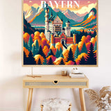 Paint by Numbers - Bavarian Dreams featuring Neuschwanstein Castle in a colorful autumn forest surrounded by the Alps, displayed on a wall above a desk