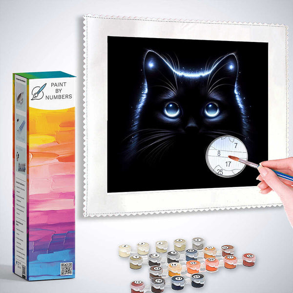 "Paint by Numbers - Sternennachtgeflüster featuring a mysterious cat with glowing, sapphire blue eyes, surrounded by painting supplies"