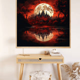 Paint by Numbers castle painting under a blood moon, reflecting in a serene lake, displayed above a desk in a cozy room.