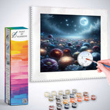 Paint by Numbers kit featuring Moonlit Night in the Enchanted Forest with paint pots and painting in progress.