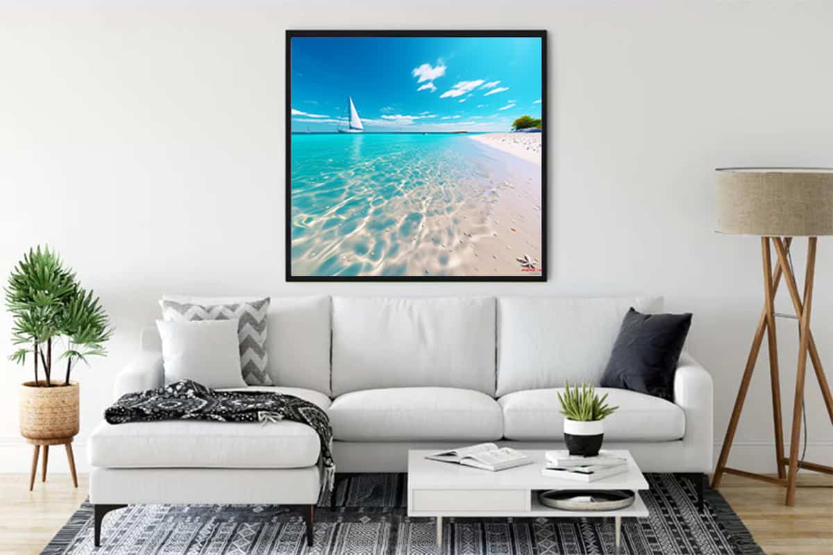 Diamond Painting - Coastal Magic displayed in living room, showing a serene beach scene with a sailboat and turquoise waters.