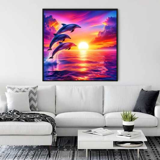 Paint by Numbers - Dance of the Ocean with three dolphins leaping against a vibrant sunset in purples and pinks, displayed above a modern sofa