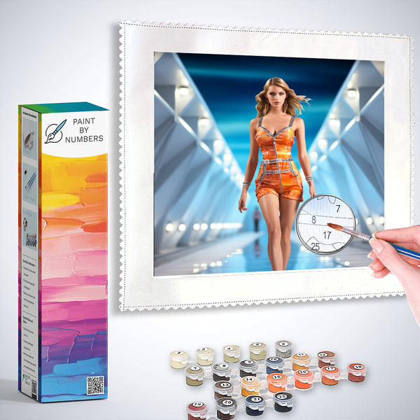Paint by Numbers kit featuring supermodel painting in vibrant orange outfit, with paint pots and brush for DIY artwork