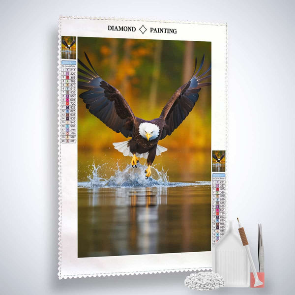 Diamond painting kit featuring an eagle design with paint by numbers supplies including canvas, acrylic diamonds, tweezers, and pen.