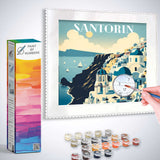 Paint by Numbers - Meeresbrise in Santorin art kit showing Santorini cliffs with classic white buildings, pastel blues, and paint supplies