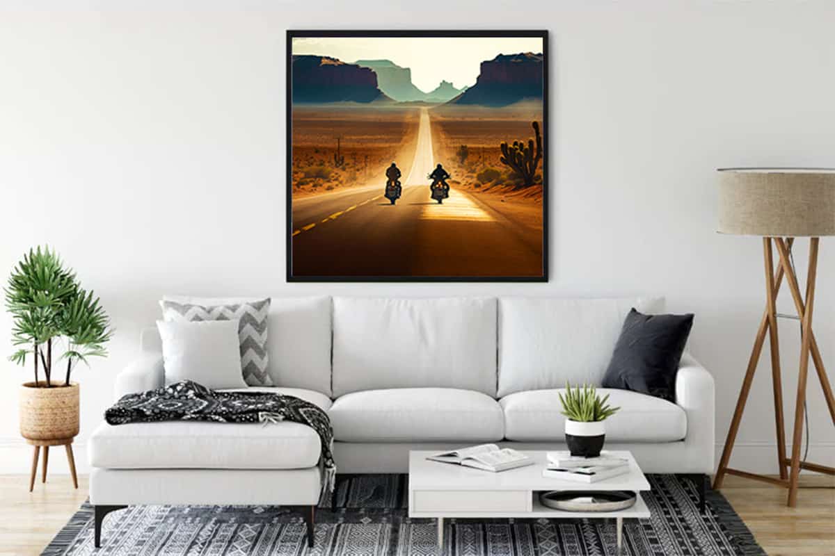 Framed landscape diamond painting depicting two motorcycles on a desert highway, enhancing modern living room decor.