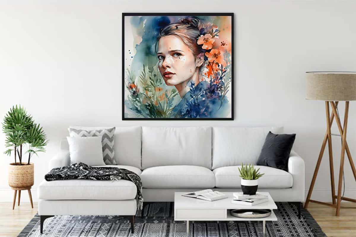 Framed diamond painting of a woman's face with floral and abstract watercolor design hanging in a modern living room.