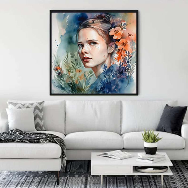 Framed diamond painting of a woman's face with floral and abstract watercolor design hanging in a modern living room.