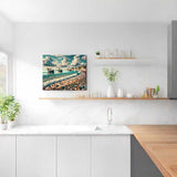 Paint by Numbers Coastal Whispers artwork depicting a peaceful Mediterranean fishing village with colorful pebbles and boats in a modern kitchen.