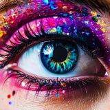 Close-up of a colorful eye with vibrant eye makeup and glitter.