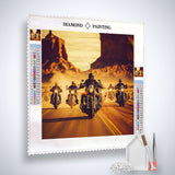 Diamond Painting kit featuring motorcyclists riding through desert landscape, includes canvas, acrylic diamonds, tweezers, and application pen.