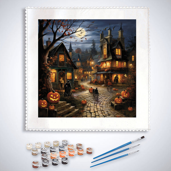Paint by Numbers Halloween village mystery kit with spooky houses, glowing pumpkins, and painting supplies