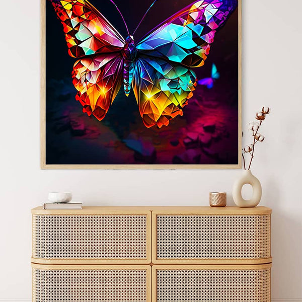 Colorful framed diamond butterfly painting kit displayed above a wooden chest, suitable for Paint by Numbers and art enthusiasts.