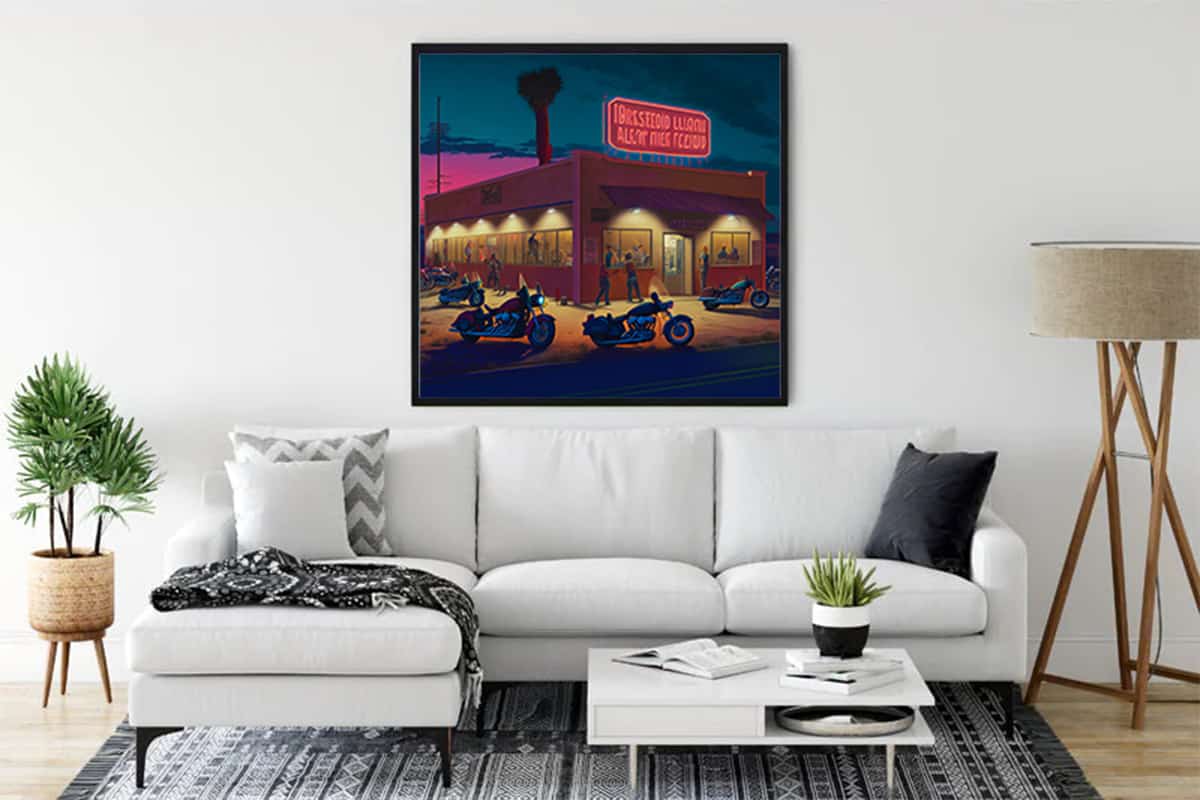Diamond Painting - Adventure Rider displayed in a modern living room, showcasing a vibrant scene of motorcycles outside a diner at night.