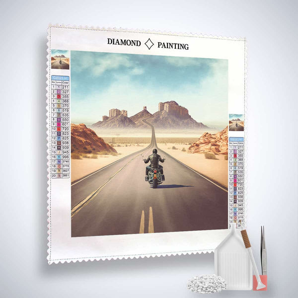 Diamond Painting Kit with a biker on a desert highway, showcasing Professional Canvas, Acrylic Diamonds, Tweezers, and Application Pen.