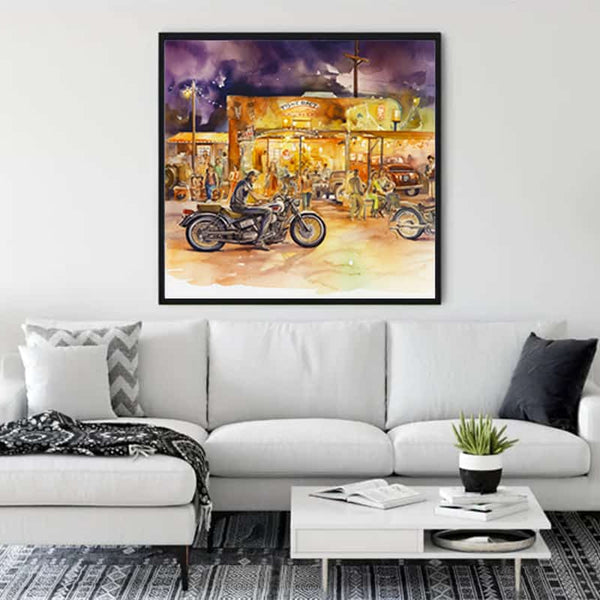 Living room with white sofa featuring a vibrant canvas painting of motorcycles and retro ambiance, enhancing the modern decor.
