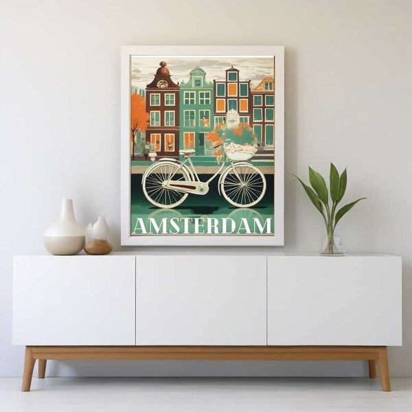 Paint by Numbers - Amsterdams Idyll framed artwork featuring a bicycle by a canal with angular houses, displayed on a minimalistic white console table.