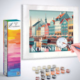 Paint by Numbers Coastal Magic of Copenhagen kit showcasing a painted harbor scene with pastel buildings and sailboats.