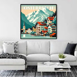 Paint by Numbers - Alpiner Zauber artwork depicting an alpine village with mountains, displayed above a white sofa in a modern living room.