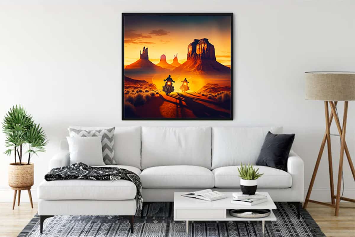 Diamond Painting - Cruiser of the Country Road displayed on a living room wall, showcasing motorcycles on a desert road at sunset.