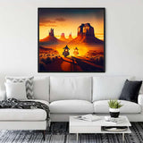 Diamond Painting - Cruiser of the Country Road displayed on a living room wall, showcasing motorcycles on a desert road at sunset.
