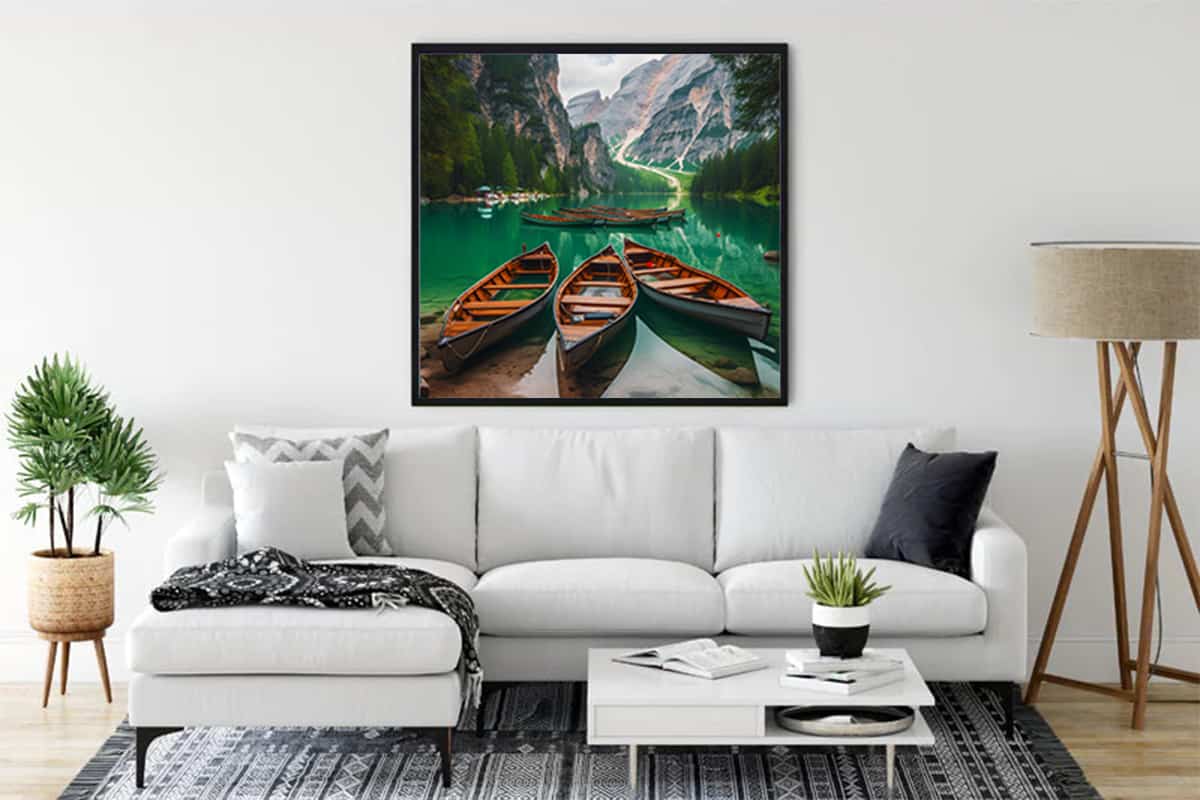 Diamond Painting of boats and mountain panorama above a white sofa in a modern living room setup