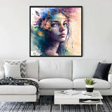 Living room with framed Diamond Painting - Proud Beauty artwork on wall above white sofa.
