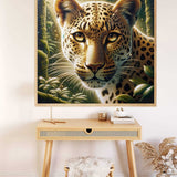 Diamond Painting - Leopard Portrait in gold, umber, and green tones with hypnotizing eyes on display in a stylish room. Paint by Numbers.